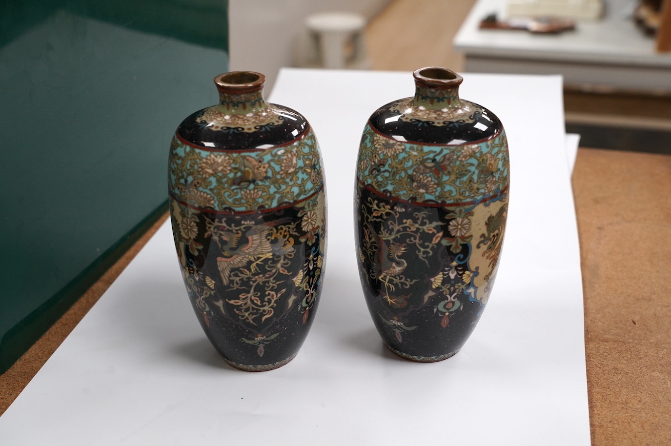 A pair of Japanese cloisonné enamel vases, signed, 14.5cm high. Condition - fair to good